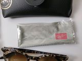 a pair of sunglasses and a case on a table