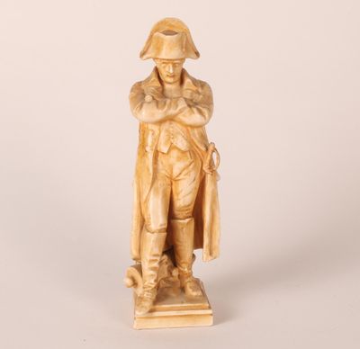 an image of a statue of a man with a hat and coat