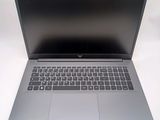 an open laptop computer sitting on top of a white table