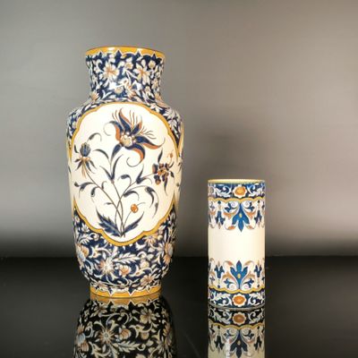 two vases sitting next to each other on a table