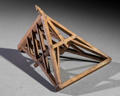 a wooden object that looks like a triangular structure