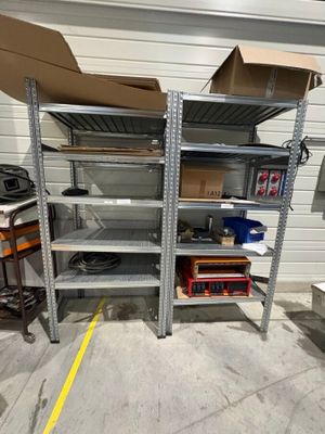 a metal shelving with a lot of items on it