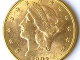 l'image d'une pièce d'or sur laquelle figure le visage d'une femme