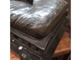 a black suitcase sitting on top of a wooden table