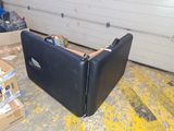 a piece of luggage sitting on the floor in a garage