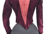 the back of a woman ' s jacket on a mannequin mannequin