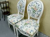 two chairs that are next to each other on the floor