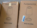 three boxes of furniture sitting on top of a floor next to each other