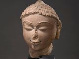 an image of a statue of a woman ' s head on a black stand