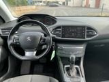 the interior of a car with a steering wheel and dashboard controls