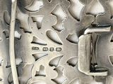 a silver belt buckle with a metal buckle on it