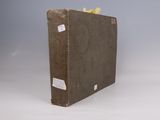 a brown book with a yellow ribbon on it