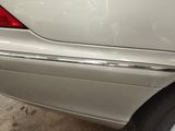 a close up of a car ' s rear end with a denting on it