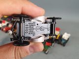 a person holding a small toy car made of legos