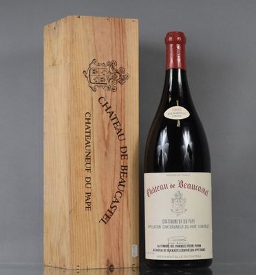 a bottle of wine in a wooden box next to a wooden box
