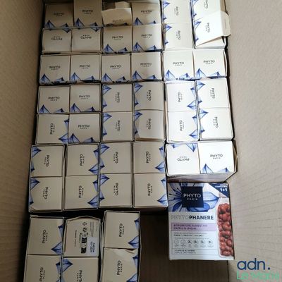 a box full of boxes of cigarettes sitting on the floor