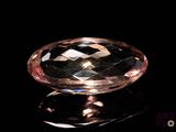 an image of a pink diamond on a black surface