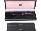 the mont blanc fountain pen is in a black box with a gold trim