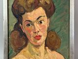 tableau représentant une femme aux cheveux bruns, dans un cadre argenté