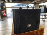 a computer on a wooden stand in a room