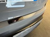 a close up of a car with a sticker on it ' s bumper