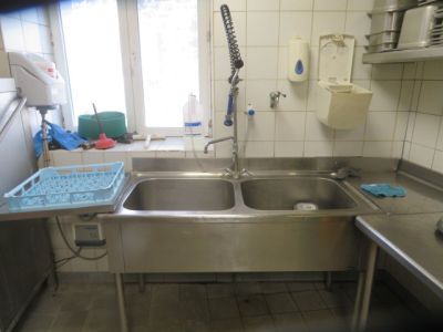 a kitchen with a sink and a window in it