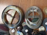 a lot of different types of buttons on a table