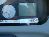 a close up of a car ' s dashboard with a clock