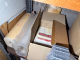 many boxes of food sitting on a shelf in a room