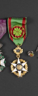 several medals are displayed on a black surface with a black background