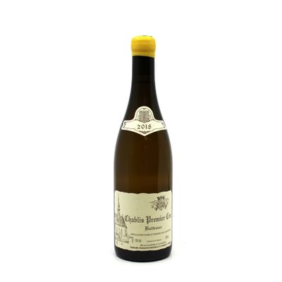 a bottle of wine that is sitting on a table