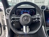 the interior of a car with a steering wheel and dashboard controls