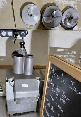 a picture of a kitchen with a chalk board and a mixer