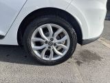 a white car parked on the side of the road