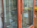 a glass case that is sitting on the ground