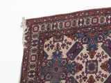an image of a rug on a white surface with a white wall in the background