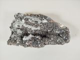 an image of a piece of rock on a white surface