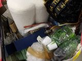 a shopping cart full of items in a store