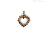 gold plated heart pendant with red and white polka dots