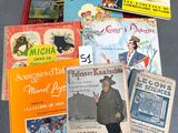 many children ' s books that are on the floor