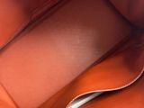 a close up of the inside of a brown leather bag