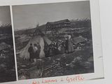 an old photo of a group of people standing in front of a tent