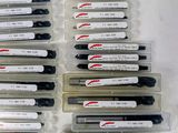 many different types of ink pens in a plastic container