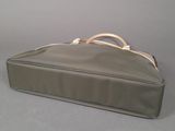 a bag that is sitting on a table with a handle