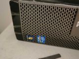 a close up of a small black computer on a table
