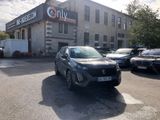 a car parked in front of a building in a parking lot