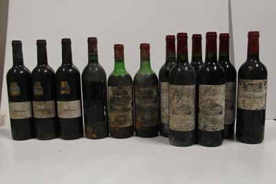 several bottles of wine are lined up in a row on a table