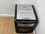 an image of a paper shredder in the corner of a room