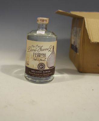 a bottle of liquor sitting next to a cardboard box