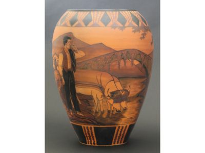 a vase with a picture of a man and animals on it